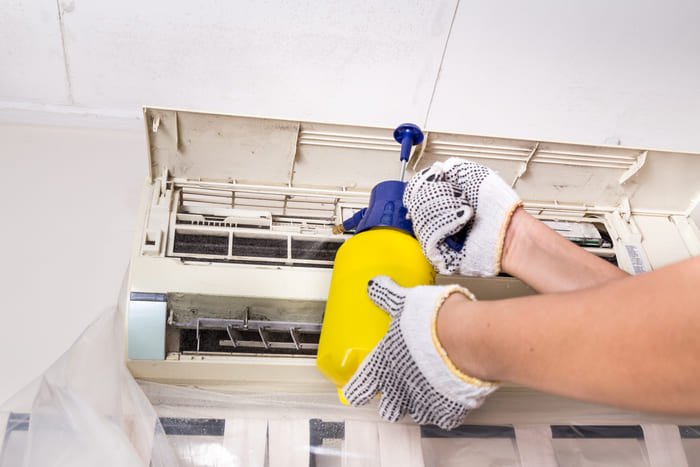 air-conditioner-cleaning-with-yellow-spray-bottle-2026-09-22-13-50-25-utc (1)